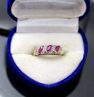 VINTAGE 9CT HALF ETERNITY YELLOW AND WHITE GOLD RUBY AND DIAMOND RING. 375