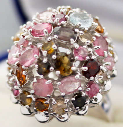 STRIKING LARGE, DOMED HEAVY, MULTICOLOURED TOURMALINE STERLING SILVER RING. 295