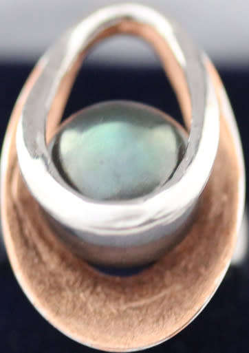 BLACK PEARL STERLING SILVER RING WITH ROSEGOLD HUE ACCENT INSIDE A DOUBLE OPEN-WORK FRAME. 925