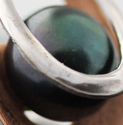 BLACK PEARL STERLING SILVER RING WITH ROSEGOLD HUE ACCENT INSIDE A DOUBLE OPEN-WORK FRAME. 925