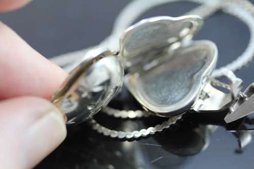 UNUSUAL AND COLLECTABLE MULTI-HEART DESIGN LOCKET IN STERLING SILVER. 4 LOCKETS for 4 PHOTOGRAPHS!
