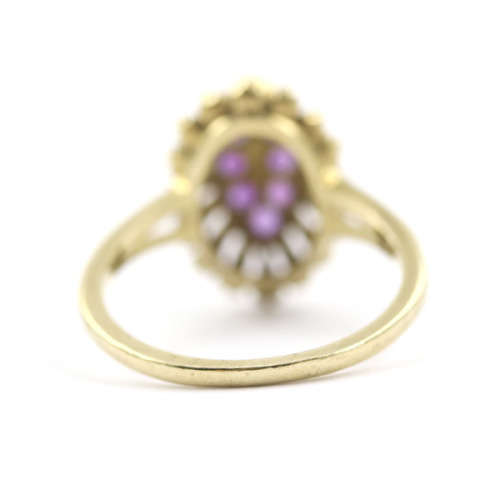 UNUSUAL AMETHYST 9CT YELLOW GOLD RING WITH DECORATIVE OPENWORK FRAME. 375. ASSAY MARK.