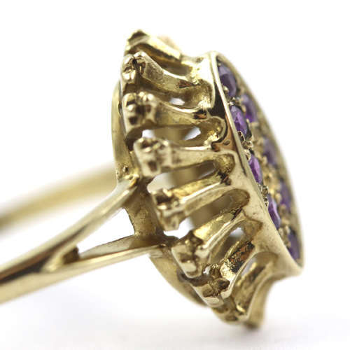 UNUSUAL AMETHYST 9CT YELLOW GOLD RING WITH DECORATIVE OPENWORK FRAME. 375. ASSAY MARK.
