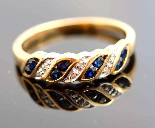 DIAMOND AND BLUE SAPPHIRE ETERNITY RING IN YELLOW AND WHITE GOLD. UNUSUAL SETTING. FULLY HALLMARKED!