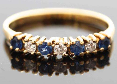 BEAUTIFUL BRIGHT BLUE SAPPHIRE AND DIAMOND ETERNITY RING. [JEWELLER CERTIFIED R4'841]