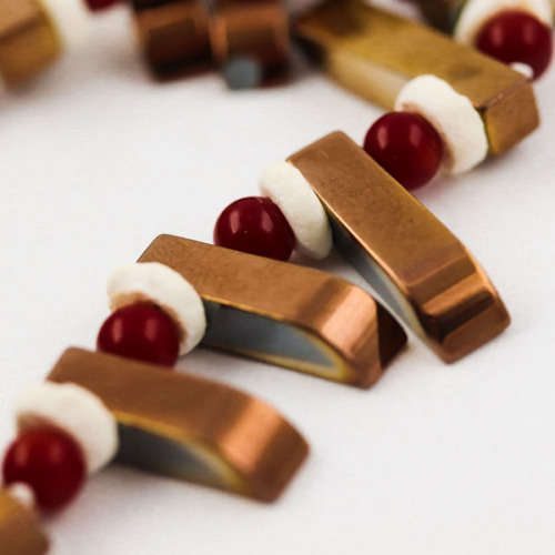 HANDCRAFTED BRONZE-COATED HEMATITE, CORAL AND OSTRICH SHELL NECKLACE. *JEWELLER EVALUATION R2`400*