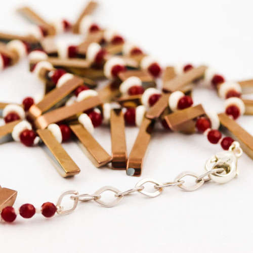 HANDCRAFTED BRONZE-COATED HEMATITE, CORAL AND OSTRICH SHELL NECKLACE. *JEWELLER EVALUATION R2`400*