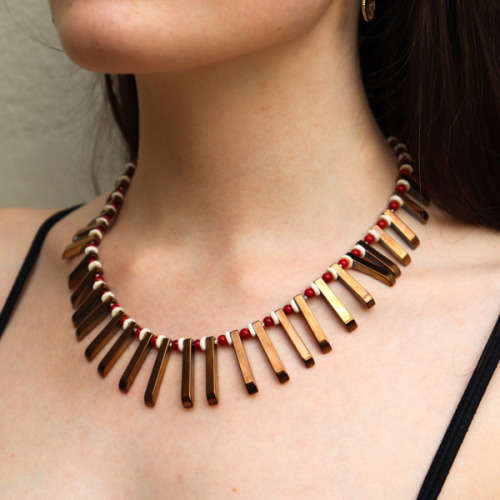 HANDCRAFTED BRONZE-COATED HEMATITE, CORAL AND OSTRICH SHELL NECKLACE. *JEWELLER EVALUATION R2`400*