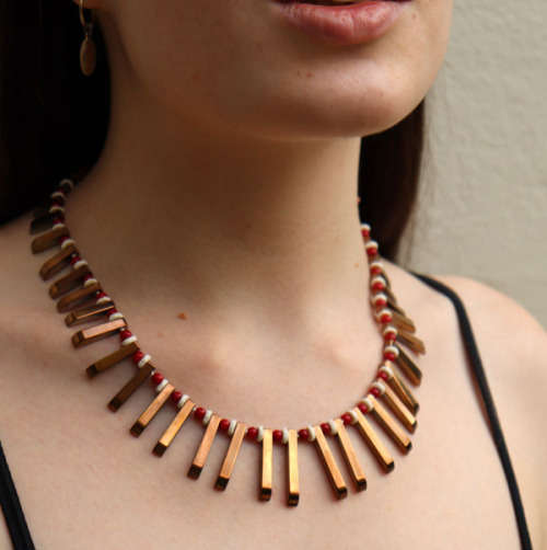 HANDCRAFTED BRONZE-COATED HEMATITE, CORAL AND OSTRICH SHELL NECKLACE. *JEWELLER EVALUATION R2`400*