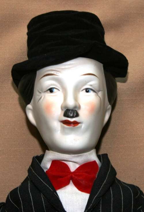 CHARLIE CHAPLIN PORCELAIN DOLL, CIRCA 1980