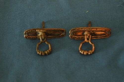 A pair of old cupboard handles, copper plated (plates a bit bent)