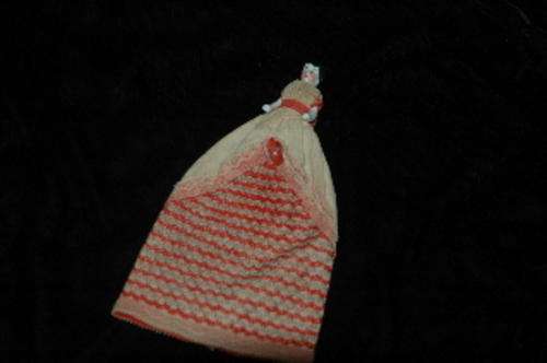 An antique porcelain doll (60mm tall) in a long dress (160mm total). Lower half of one leg missing.
