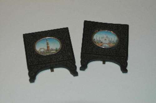 A pair of miniature paintings in silver mounts in beautifully carved stands. see desc