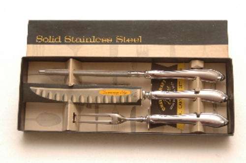 Solid stainless steel carving set by Oneida silversmiths, never used