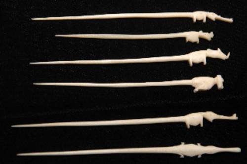 Vintage cocktail sticks, handcarved animals in ? bone?