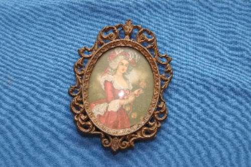 Small (130mm x 90mm) ornate brass frame (with glass) made in Italy. NB ppart of a scroll missing.