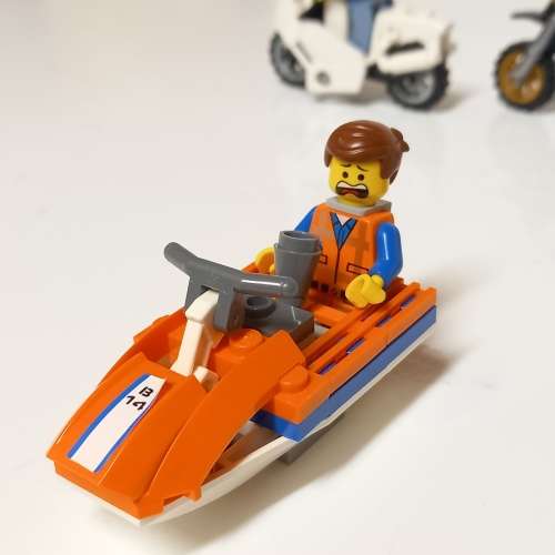 Four Lego Minifigurines And Lego Vehicles