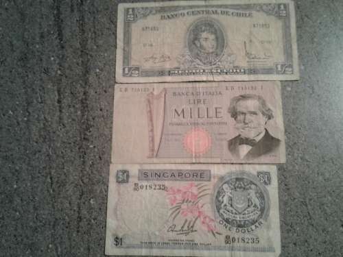 Rarities.1962 Chilean half medio escudo,1975 Italian 1000 lire  and a 1972 Singaporean 1 dollar .