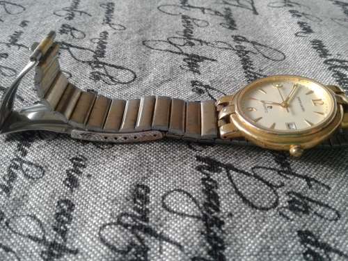 SOLID PIERRE CARDIN GENT'S WRIST WATCH. GOLD TONED WORKING CONDITION.