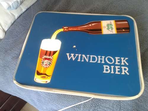 GERMAN MADE WINDHOEK LAGER POURING BEER ADVERTISING SIGN .WORKING ORDER.
