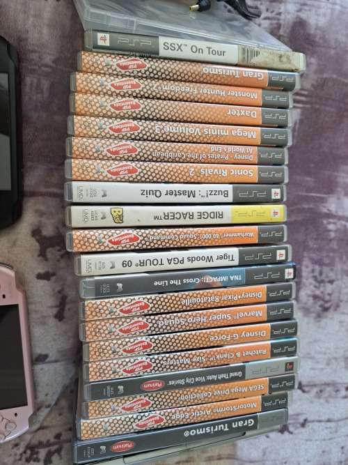 2x PSP,CHARGER AND 22 GAMES ALL FOR ONE BID