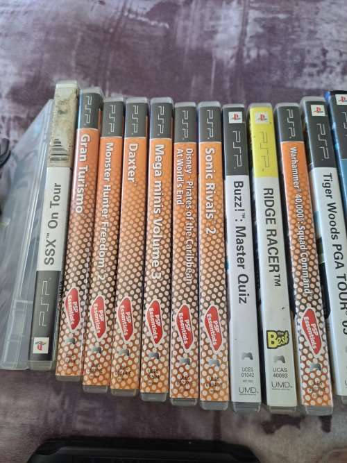 2x PSP,CHARGER AND 22 GAMES ALL FOR ONE BID