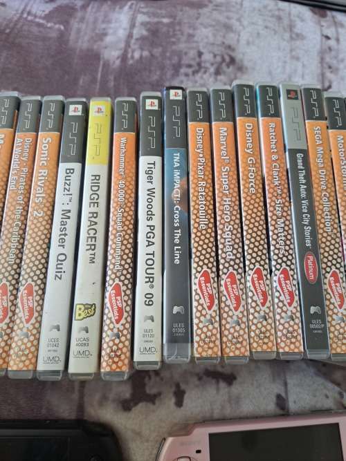 2x PSP,CHARGER AND 22 GAMES ALL FOR ONE BID