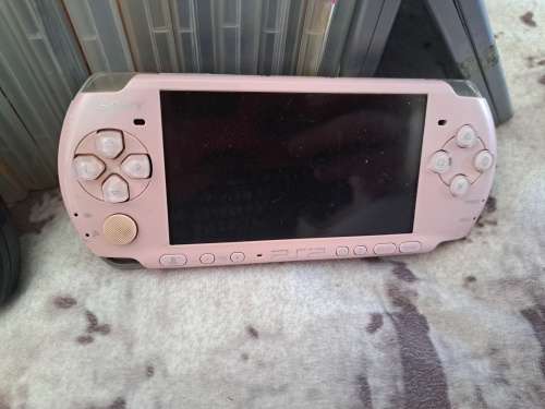 2x PSP,CHARGER AND 22 GAMES ALL FOR ONE BID