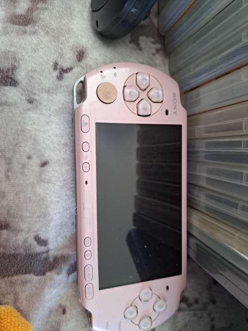 2x PSP,CHARGER AND 22 GAMES ALL FOR ONE BID