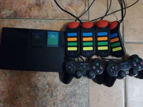 PS2 with 2 controllers, 4 buzzers, 11 games