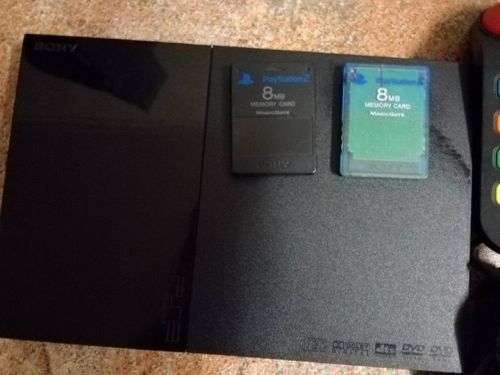 PS2 with 2 controllers, 4 buzzers, 11 games