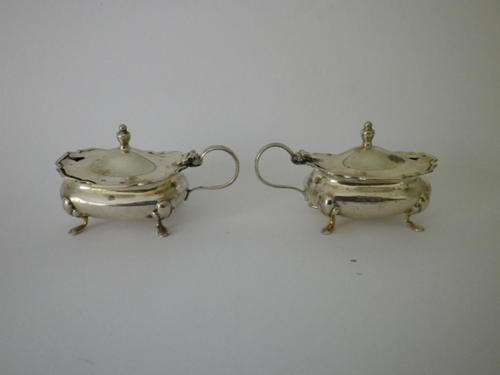 A pair of silver cellars , Birmingham 1902-3 with cobalt  glass linings.