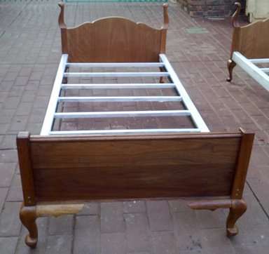 2 Queen Anne Single Beds with steel bases.