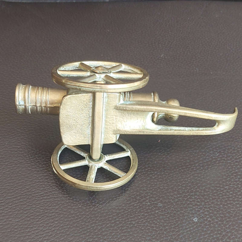 Small beautifully made brass plated cannon with wheels and rammer