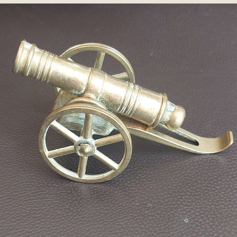 Small beautifully made brass plated cannon with wheels and rammer