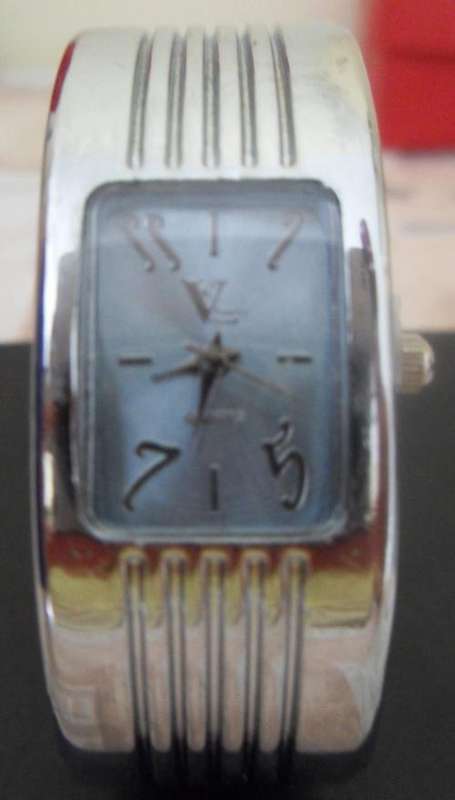 Silver watch with blue face - bangle style