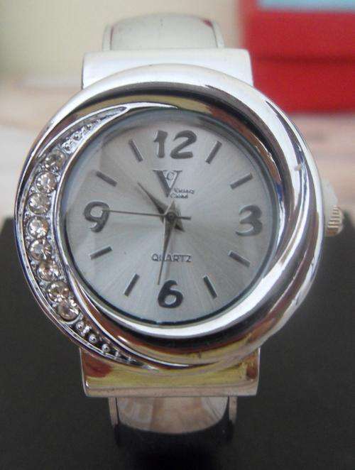 Silver watch with diamonds on side - bangle style