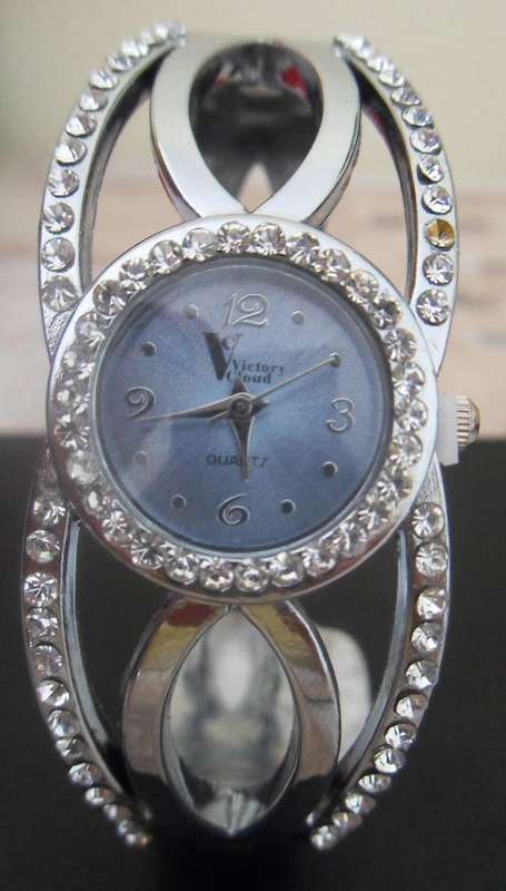 Silver weaved watch with blue face - bangle style