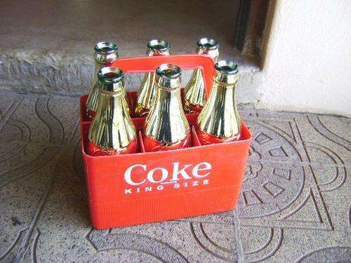 RARE 1950'S 6 EMBOSSED GOLD COCA-COLA BOTTLES IN CARRIER