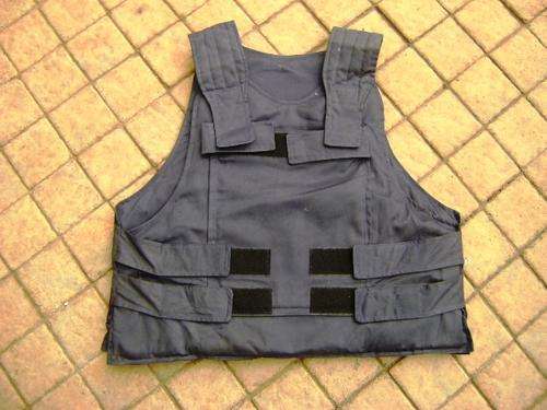 PADDED BULLET PROOF VEST IN GOOD CONDITION.