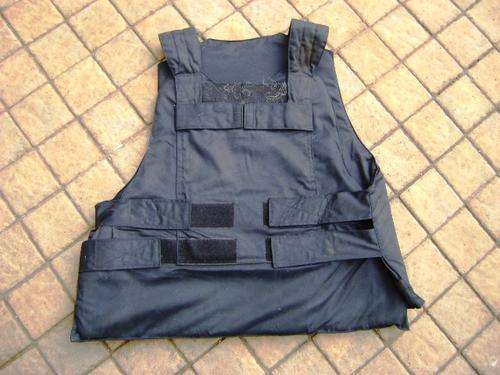 PADDED BULLET PROOF VEST IN GOOD CONDITION.