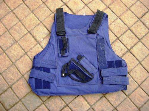 PADDED BULLET PROOF VEST IN GOOD CONDITION.