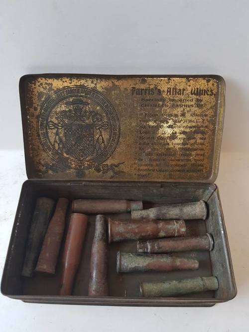 TIN WITH BOER WAR ERA SHELL CASINGS