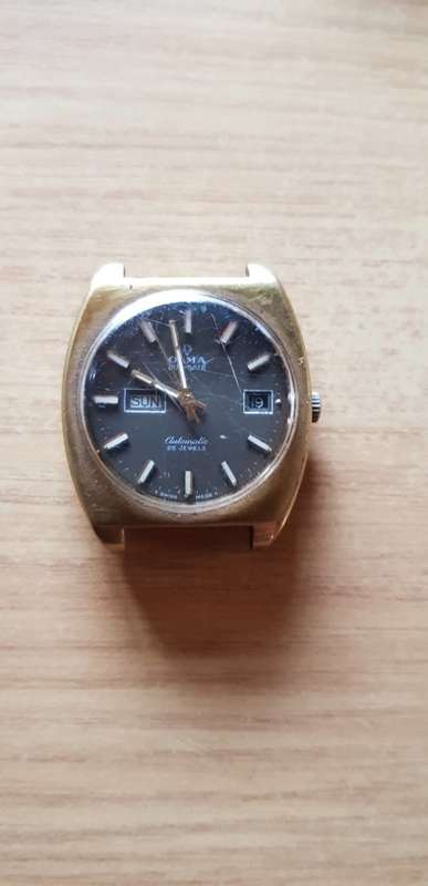 VINTAGE OLMA SWISS DUO DATE AUTOMATIC WATCH. RUNNER