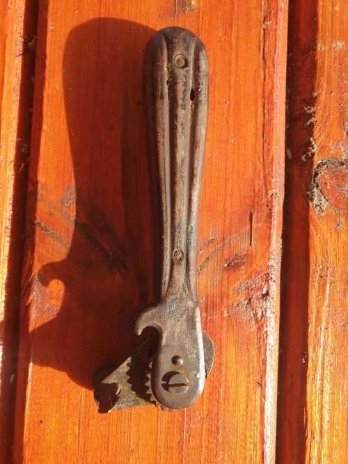 ANTIQUE TIN OPENER.
