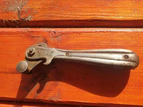 ANTIQUE TIN OPENER.