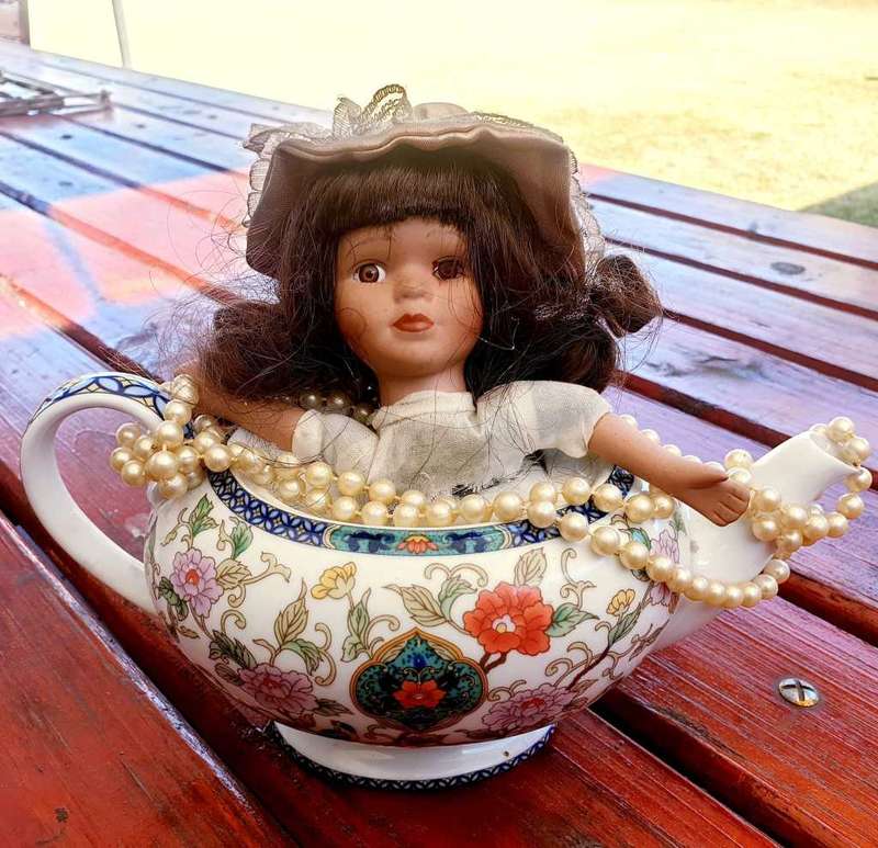 VINTAGE PORCELAIN DOLL IN TEAPOT