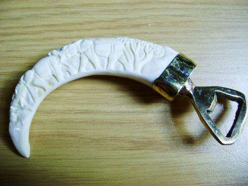HAND CARVED WART HOG IVORY TOOTH BOTTLE OPENER