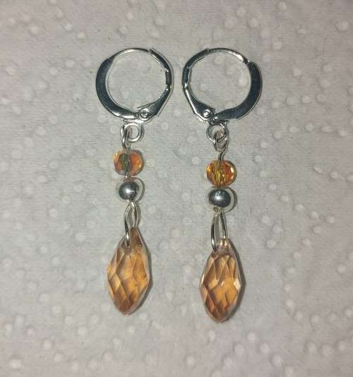 Sterling silver huggies with Swarovski crystal yellow drops. E54