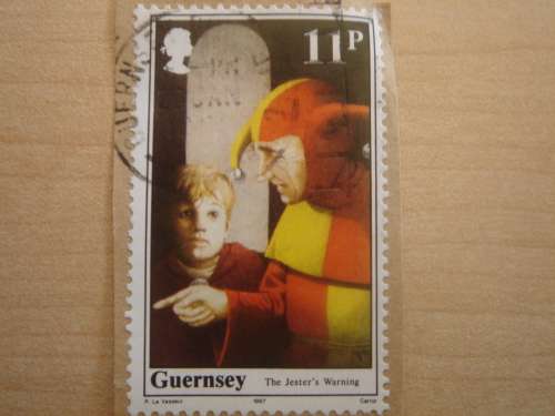 1987 Guernsey postal item with 11 p stamp, The Jester`s Warning